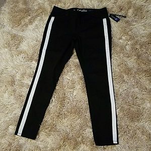INC skinny black denim with white stripe.
